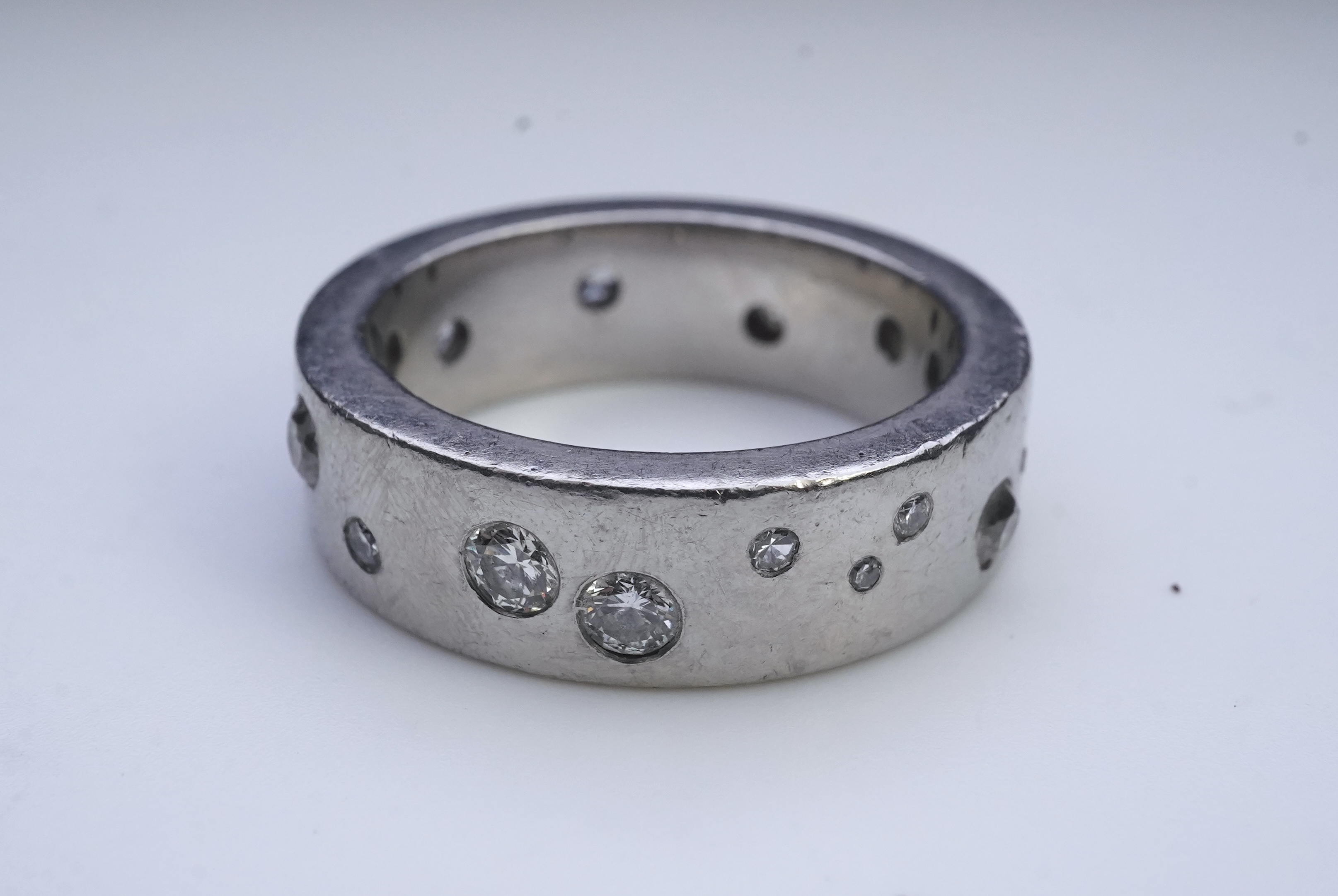 A platinum and diamond eternity ring